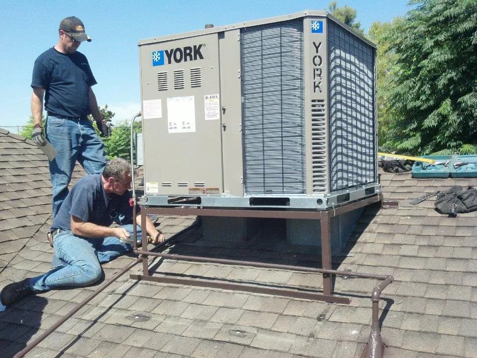 Cal Climate Corp crew installing a rooftop HVAC unit on a Los Angeles home